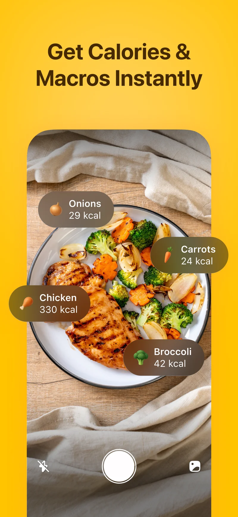 Fitia photo-based calorie tracking instantly identifying chicken, broccoli, carrots, and onions with calorie counts from a meal photo
